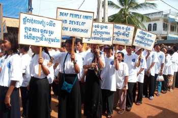 Deaf marchers with signs